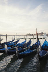 Gondolas moored on canal against Church of San Giorgio Maggiore - CAVF67233
