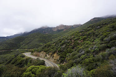 Scenic view of Santa Monica Mountains during foggy weather - CAVF67451