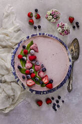 Overhead view of strawberry cheesecake on table - CAVF67474