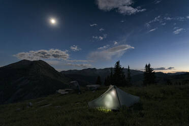 Scenic view of tent on field against sky at night - CAVF67653