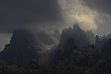 Scenic view of mountains against cloudy sky - CAVF67703