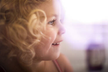 Close-up of cute girl looking away - CAVF67774