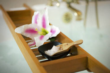 Flower with salt crystals in wooden tray for spa treatment - CAVF67936