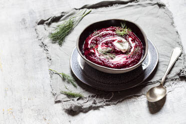 Bowl of traditional borscht with sour cream and dill - SBDF04087