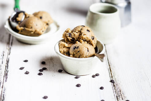 Raw vegan chocolate chip cookie dough made from almond meal, coconut flour, coconut oil, chocolate chips and maple syrup - SBDF04094