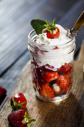Jar of fresh strawberries with whipped cream - SBDF04106