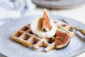 Thick Belgian waffle with whipped cream, powdered sugar and figs - SBDF04113