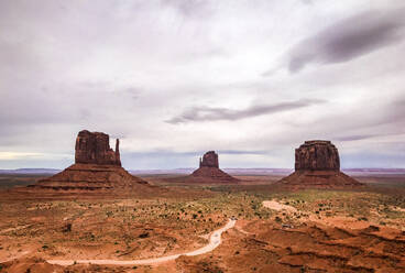 Rock formations at Monument Valley against cloudy sky - CAVF68247