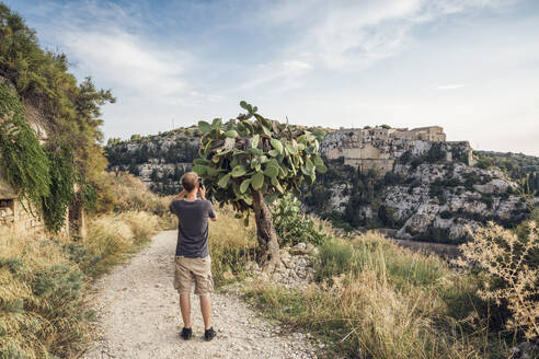 Hiker photographing cactus, Scicli, Sicily - MAMF00938