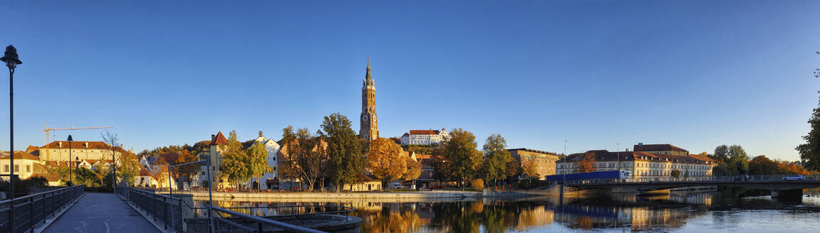 Germany, Bavaria, Landshut, Panorama of riverside town in autumn - MAEF12960