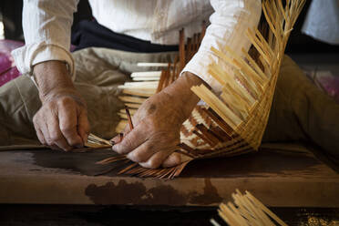 Japan, Takayama, Craftsman making baskets in workshop - ABZF02743
