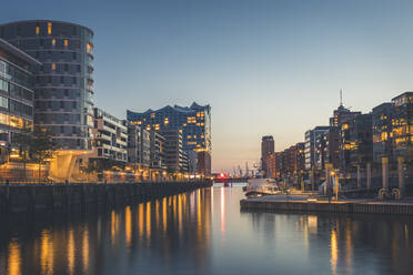 Germany, Hamburg, Hafencity, Sandtorhafen, Elbphilharmonie at dusk  - KEBF01398