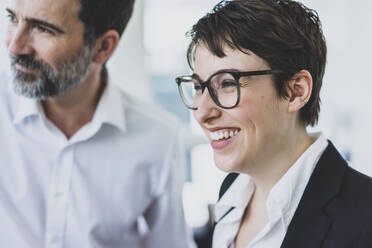 Portrait of happy businesswoman and businessman - MOEF02633