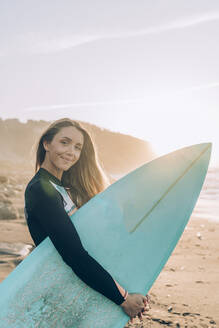 Young blond surfer at the beach of Sopelana, Spain - MTBF00102