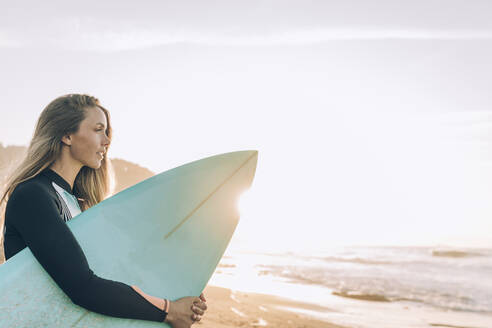 Young blond surfer at the beach of Sopelana, Spain - MTBF00104