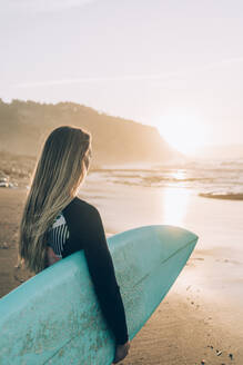 Young blond surfer at the beach of Sopelana, Spain - MTBF00106