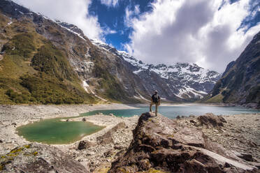 Hiker looking to Lake Marian, Fiordland National Park, South Island, New Zealand - SMAF01665