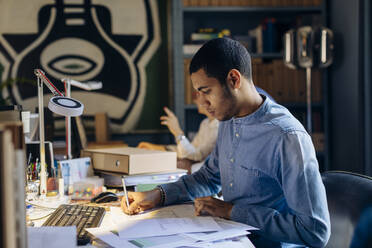 Young man working in architect's office - SODF00206