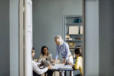 Architects having a meeting, discussing a project - SODF00243