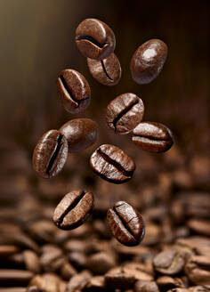 close up of falling coffee beans - RAMF00084