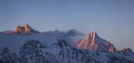 Scenic view of snowcapped mountain against clear blue sky during sunset - CAVF68275