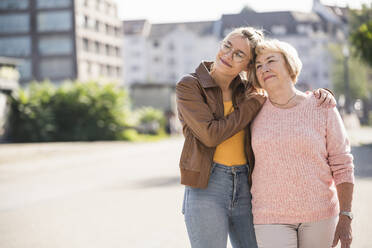 Granddaughter embracing her grandmother - UUF19514