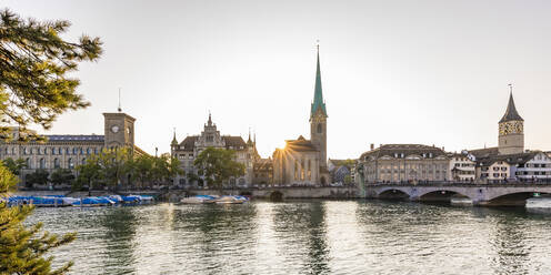 Switzerland, Canton of Zurich, Zurich, River Limmat and old town waterfront buildings at sunset - WDF05550