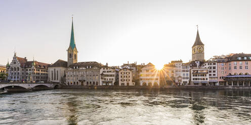 Switzerland, Canton of Zurich, Zurich, River Limmat and old town waterfront buildings at sunset - WDF05551