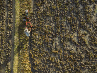 Farmer doing field work, Bali, Indonesia - KNTF03667