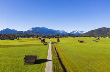 Germany, Bavaria, Upper Bavaria, Werdenfelser Land, Krun, Green fields and Wetterstein Mountains - LHF00750