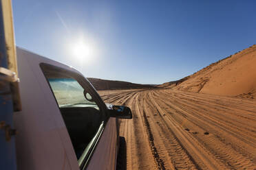 USA, Arizona, Car on desert road - GIOF07589