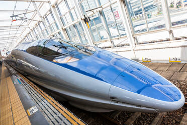 Blue Shinkansen Bullet Train at the platform of Tokyo Station, Japan. - MINF12864