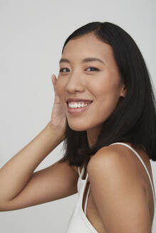 Portrait of young smiling female Chinese woman - PGCF00050