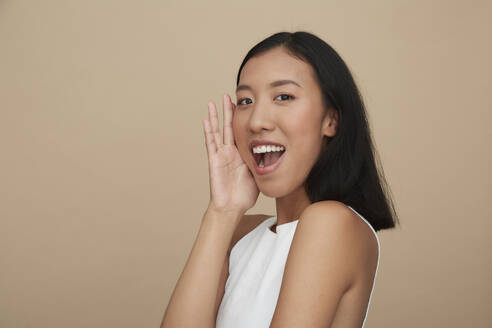 Portrait of young female Chinese woman, open mouth - PGCF00053