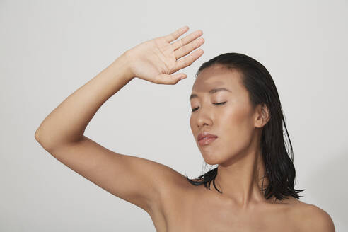 Portrait of young female Chinese woman with closed eyes - PGCF00065