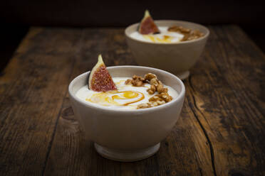 Bowls of Greek yogurt with honey, walnuts and fig - LVF08416
