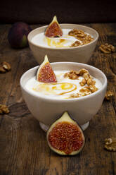 Bowls of Greek yogurt with honey, walnuts and fig - LVF08418