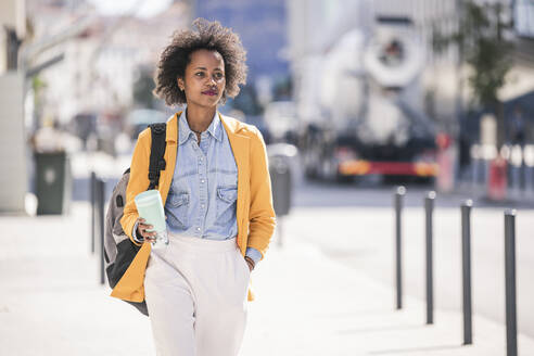 Young woman in the city on the go - UUF19602