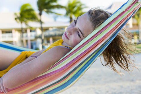 A teenage girl resting in hammock - MINF12976