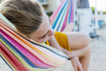 A teenage girl resting in hammock - MINF12977
