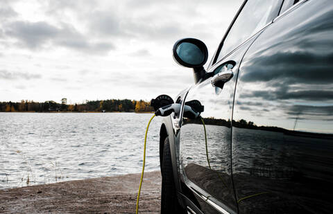 Mini Countryman car charging socket and lead by the beach stock photo
