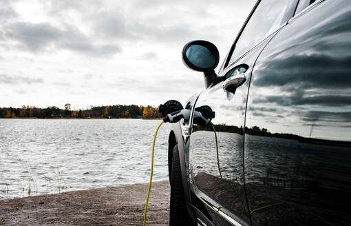 Mini Countryman car charging socket and lead by the beach - CAVF68658