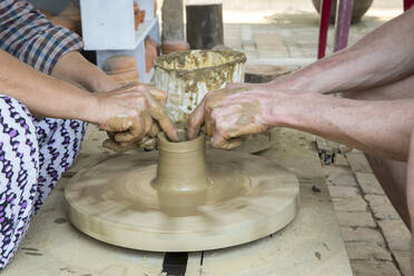 many clay pot make mud pottery on potters wheel. creating pots by shaping air  drying clay with both hands. mold with clay. practicing with modeling Stock  Photo - Alamy