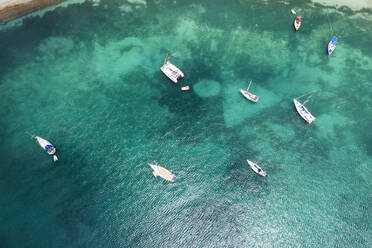 Aerial view by drone of sailboats and catamarans moored in the Caribbean Sea, Antilles, West Indies, Caribbean, Central America - RHPLF12695