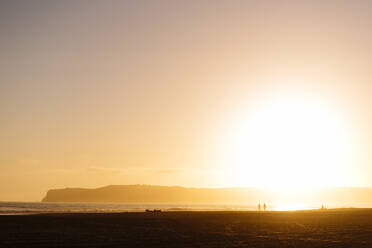 Scenic view of beach during sunset - CAVF69278