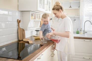 Mother with her little boy in the kitchen - EYAF00676