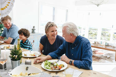 Family talking and bonding at home party - ISF22761