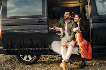 Young couple on a trip in a camper van having a break - MPPF00263