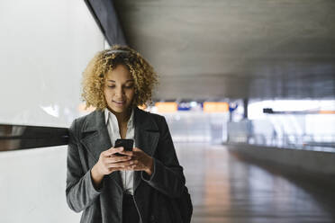 Woman with headphones and smartphone - AHSF01277