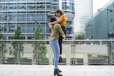 Cheerful lesbian couple in the city, London, UK - FBAF00978